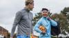 After playing football, two men chat in English, the world's global language